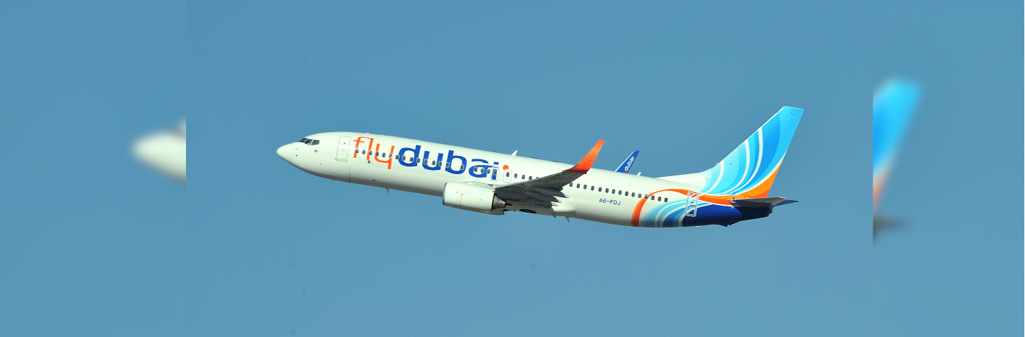 A flydubai plane in mid-air.