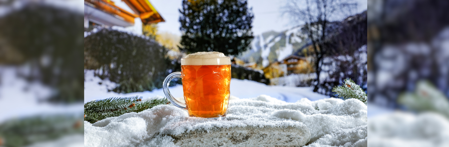 Image of a pint of beer in the snow. 