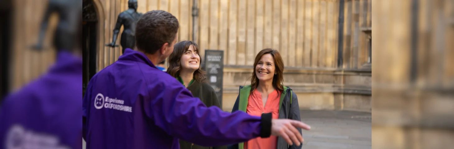 An Experience Oxfordshire tour guide showing guests around Oxford University.