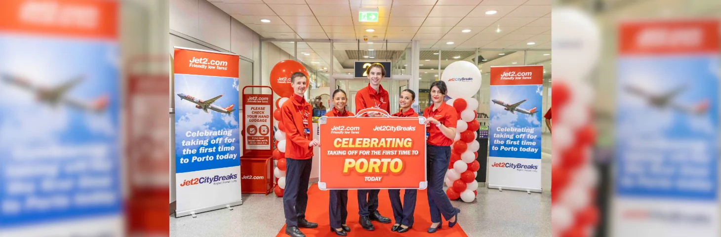 Jet2.com staff at Manchester Airport celebrating the airline's inaugural Porto service.