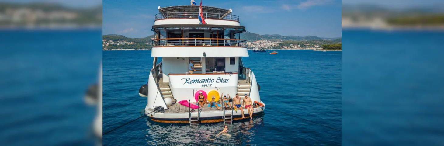 The stern of MS Romantic Star, with guests sunbathing.