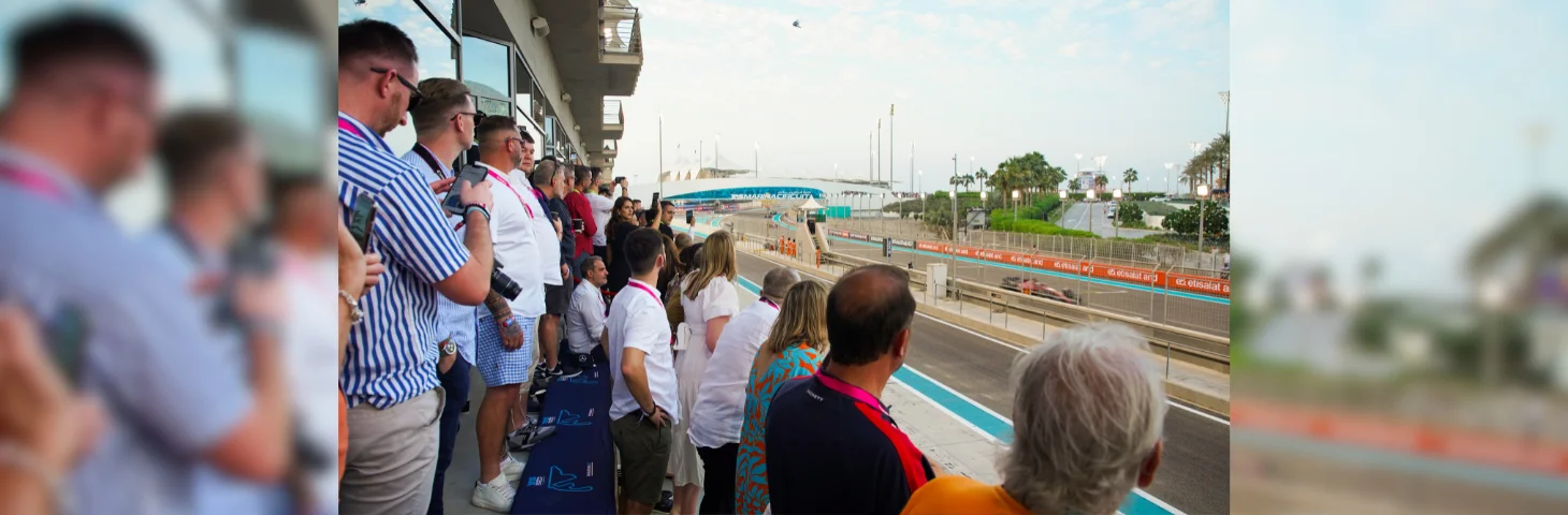 F1 fans watching the Grand Prix at Yas Marina Circuit, Yas Island, Abu Dhabi.