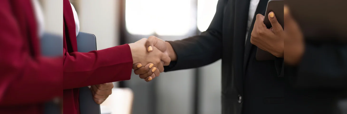 Two businesspeople shaking hands.