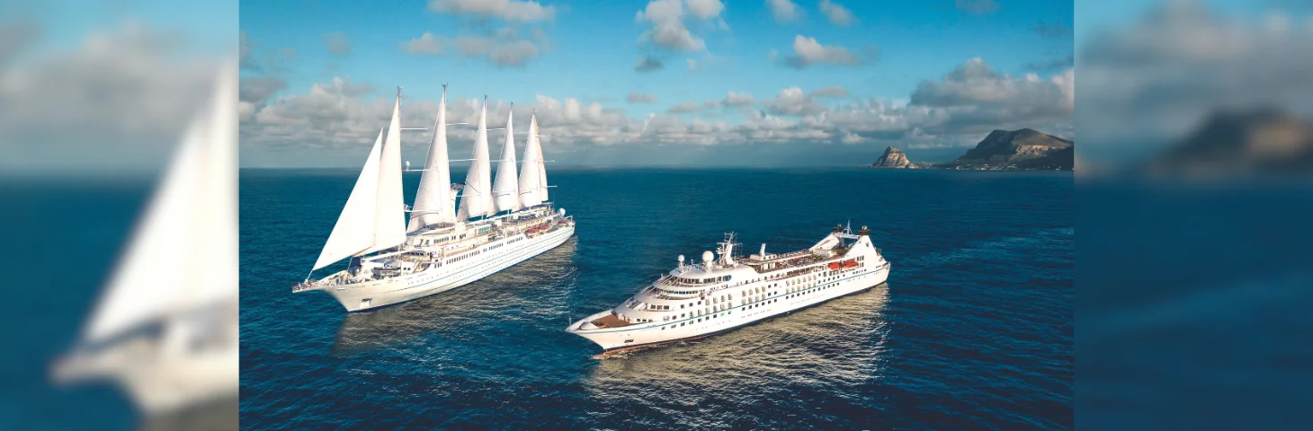 Two Windstar Cruises ships at sea.