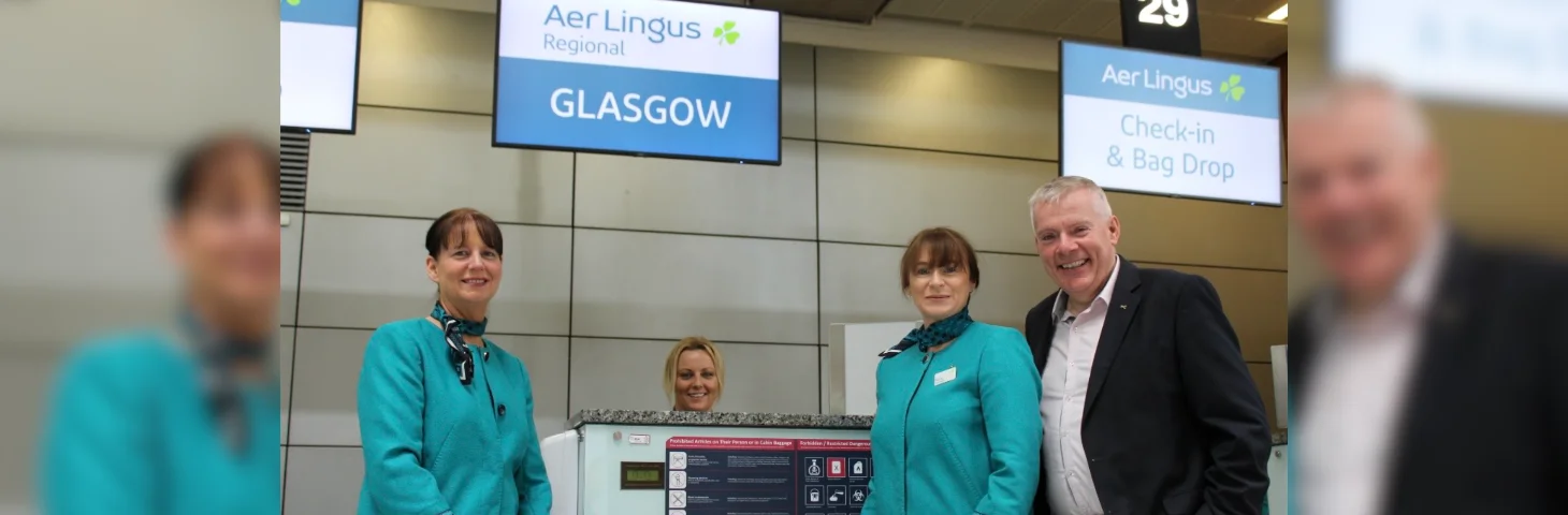 Aer Lingus staff at the check-in desk at Glasgow Airport. 