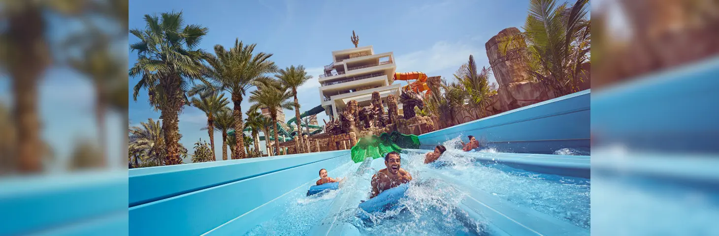 A family enjoying the Aquaventure Waterpark in Dubai.