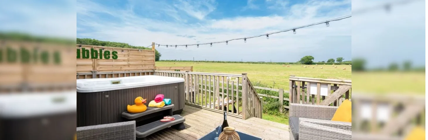 The veranda of a lodge at Raywell Hall Country Lodges