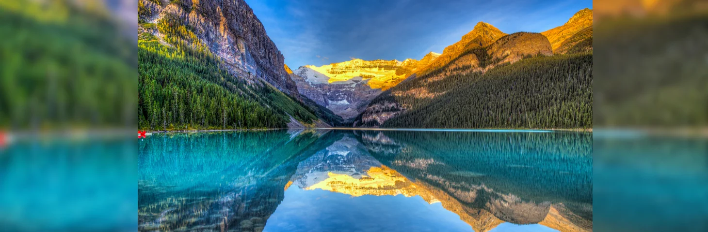 Mountains reflected in Lake Louise at Banff National Park. 