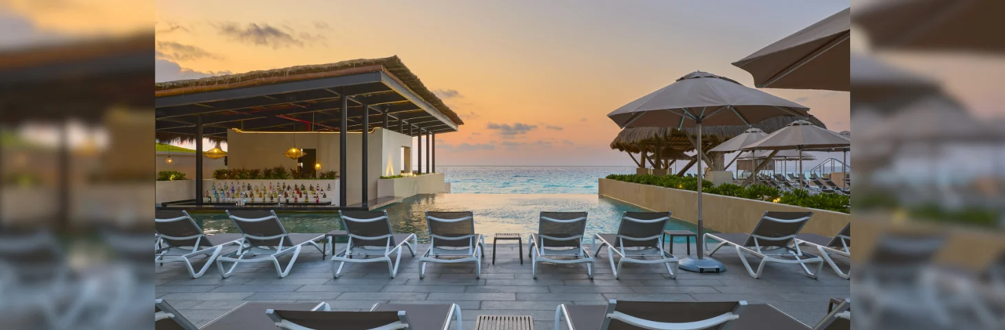 The pool area at Marriott Cancun Resort, overlooking the sea.