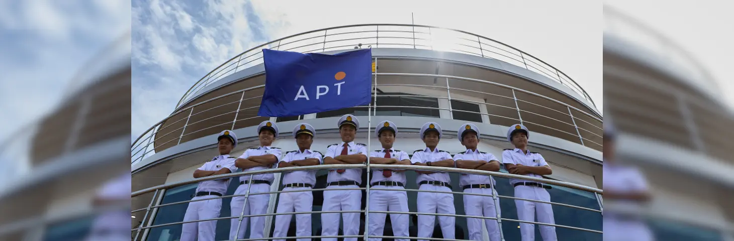 Image of an APT vessel in Cambodia with the crew on deck.