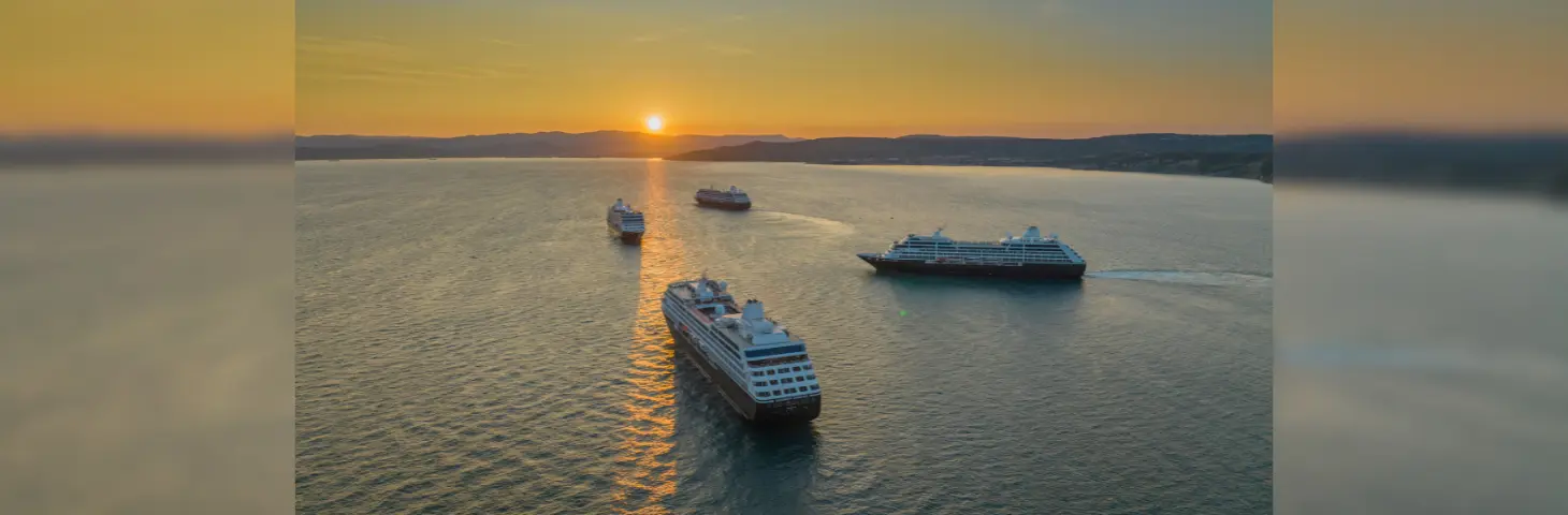 Image of the Azamara fleet sailing in the sunset