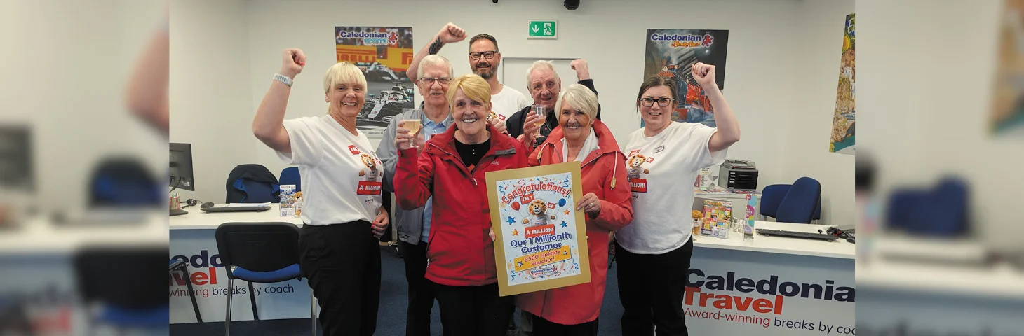 Mrs Pam Renwick (centre left) celebrates with staff at Caledonian’s Middlesbrough Travel Centre after becoming the company’s one millionth customer.