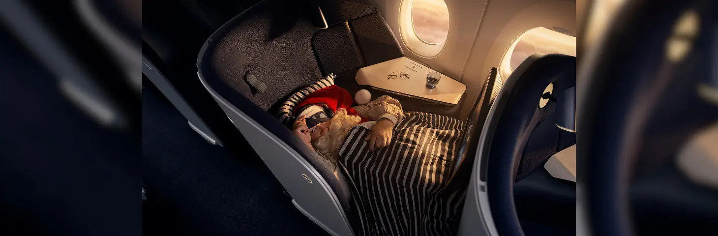 Image of Santa sleeping on a Finnair plane