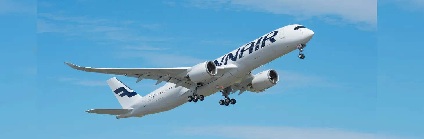 Image of a Finnair plane in flight. 