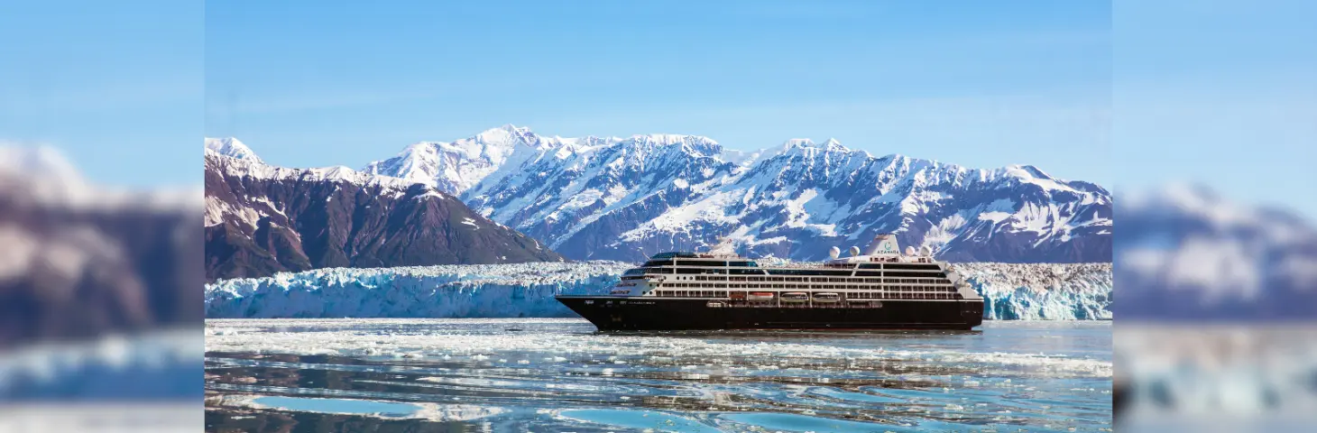 Image of Azamara Pursuit in icy waters in front of snow-capped mountains