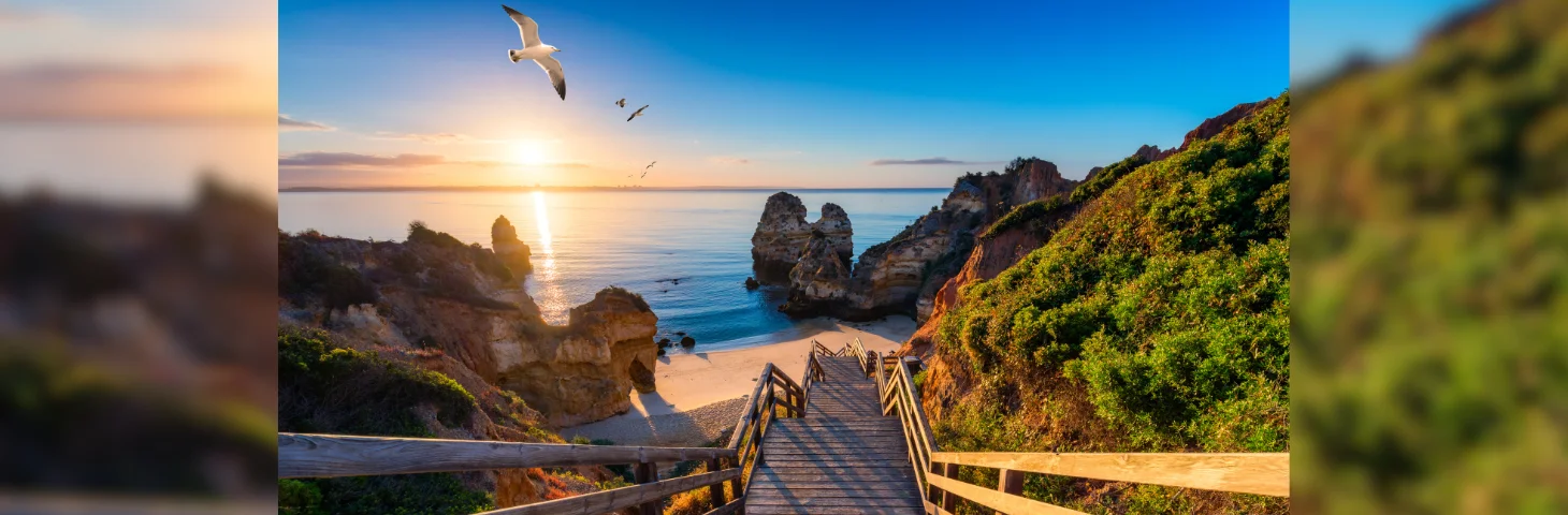 A wooden staircase leading to a beach in The Algarve.