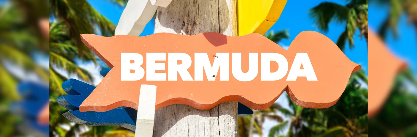 An orange sign pointing right, labelled 'Bermuda'