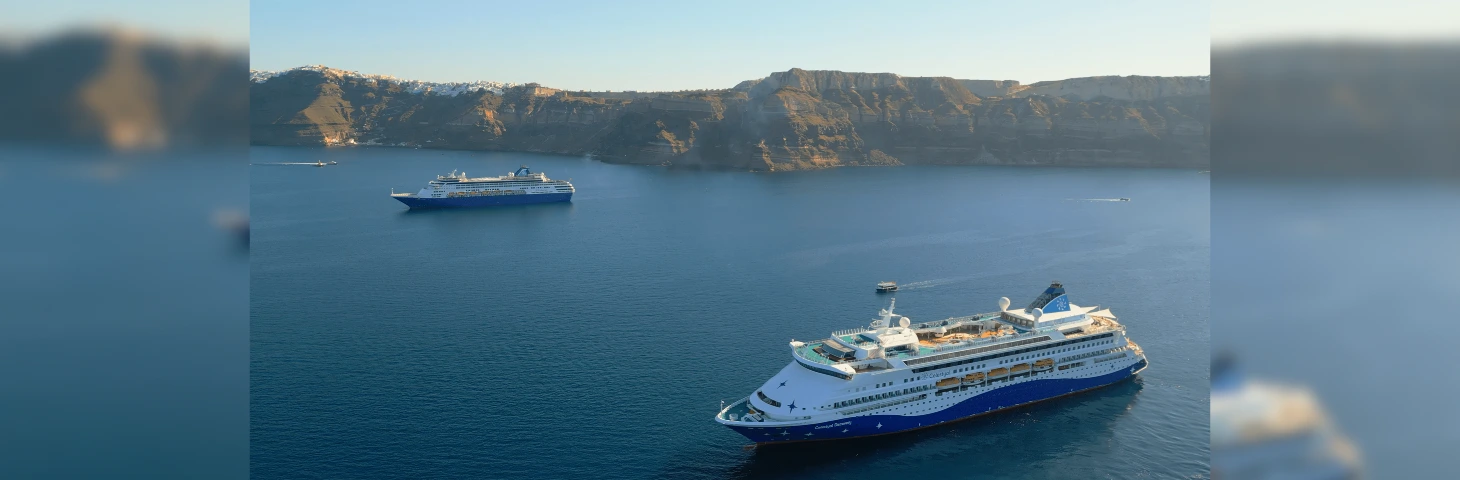 Both Celestyal cruise ships at sea in Santorini.