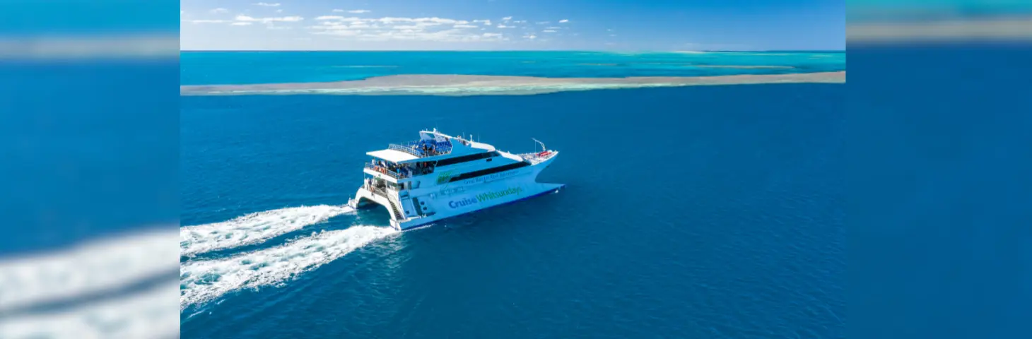 Image of a Cruise Whitsundays ship sailing on a Great Barrier Reef adventure