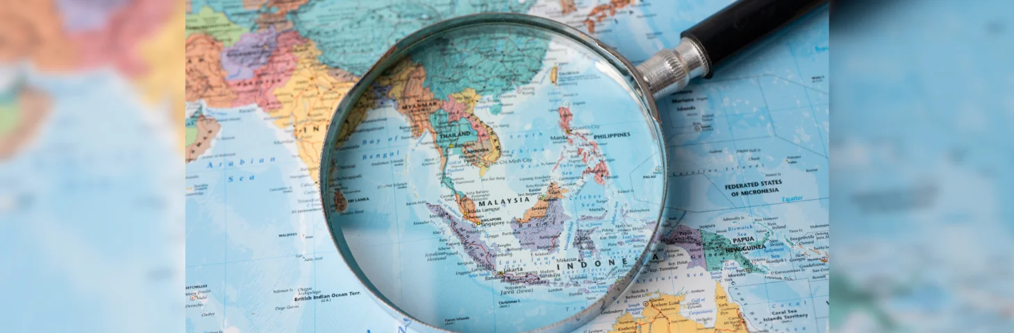 A magnifying glass focused on Pacific Asia.