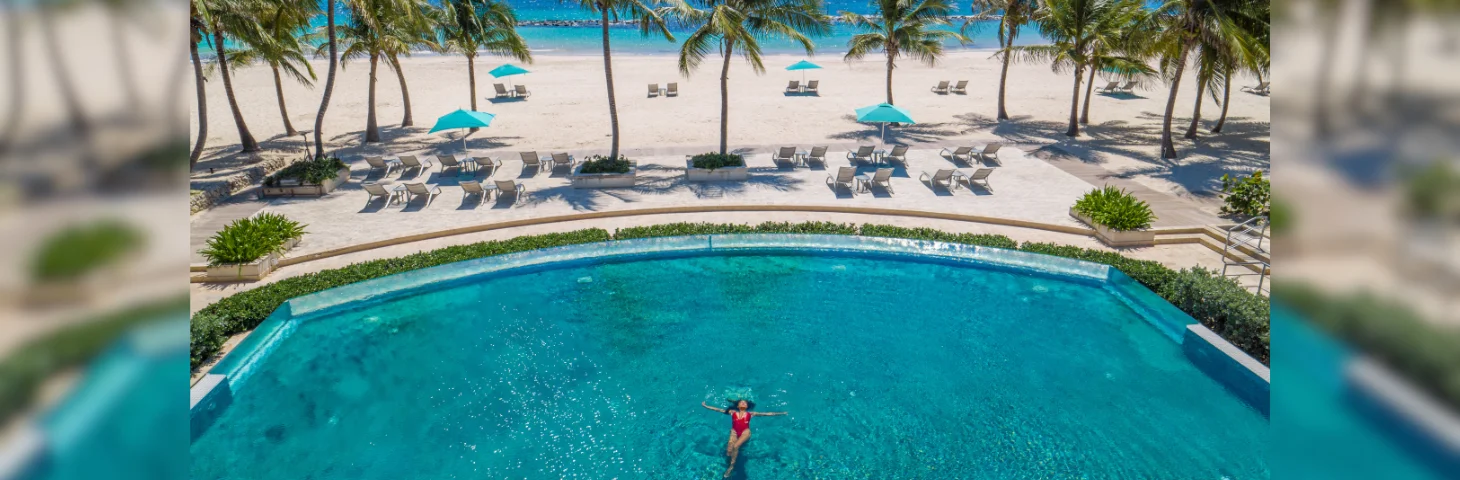 An aerial drone shot of the beachfront pool area at Sandals Royal Barbados.