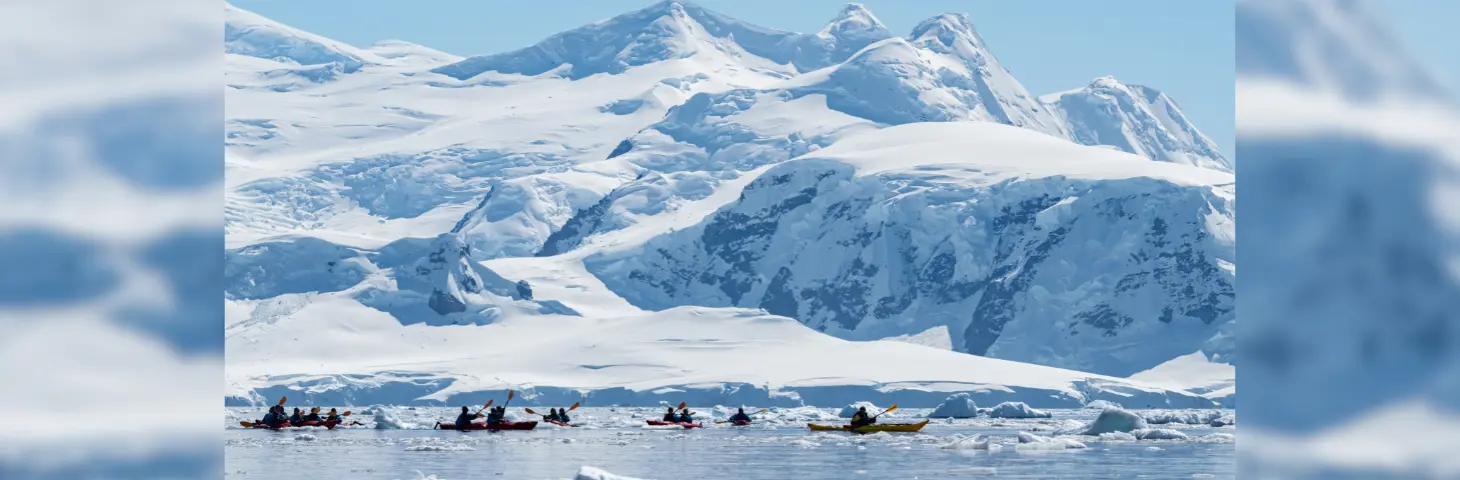 kayakers in the waters of Antarctica