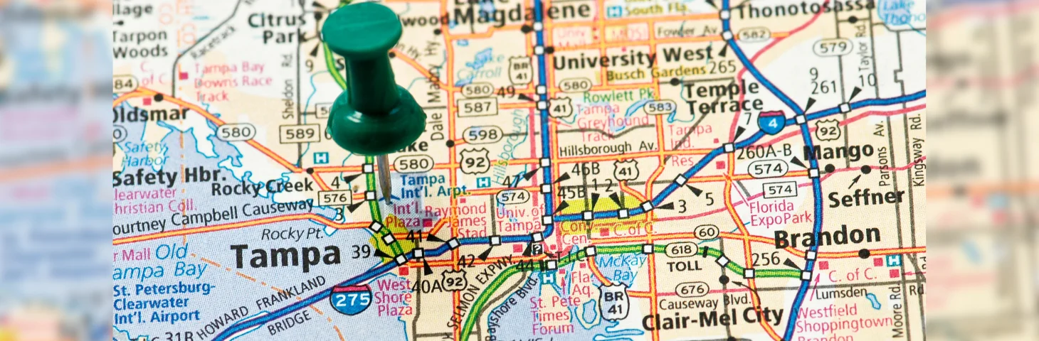 A map of Florida with a green pin in Tampa.