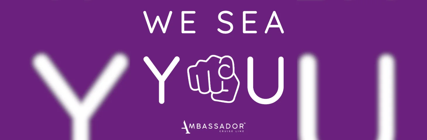 An Ambassador Cruise Line banner declaring 'We Sea You', celebrating National Travel Agent Day.
