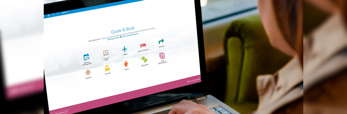 A Travel Counsellor using the Phenix booking platform on their laptop.