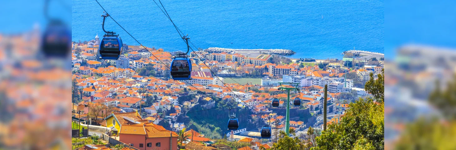 Cable cars travelling over Funchal, Madeira.