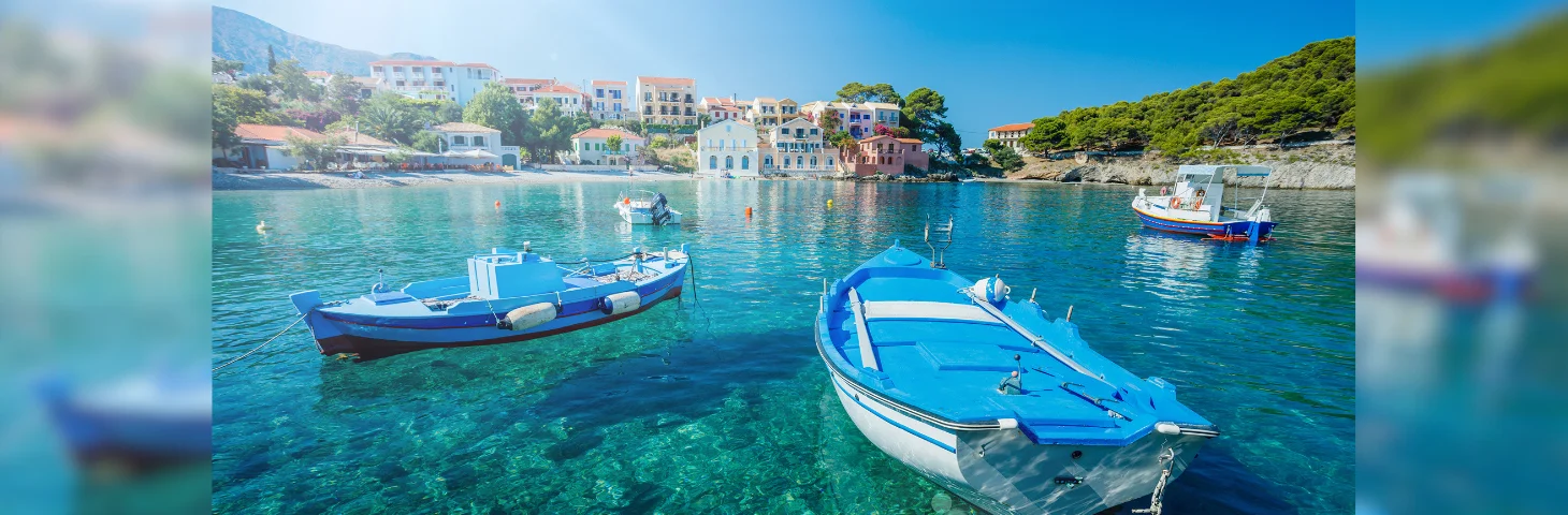 Several boats docked in the seafront area of Kefalonia.