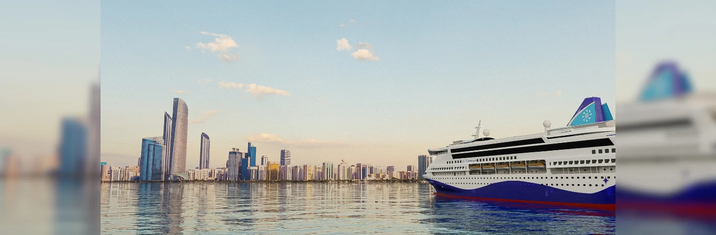 Celestyal Discovery sailing in the Arabian Gulf with Abu Dhabi on the horizon.