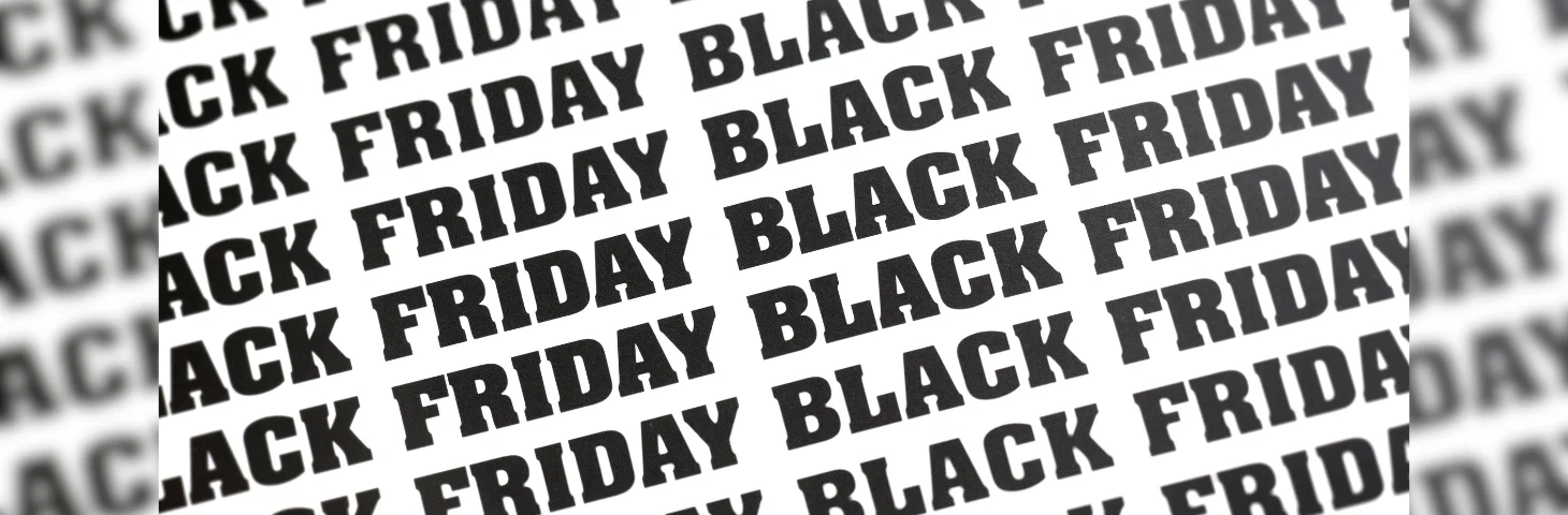 A print repeating the words BLACK FRIDAY in bold, black typeface.