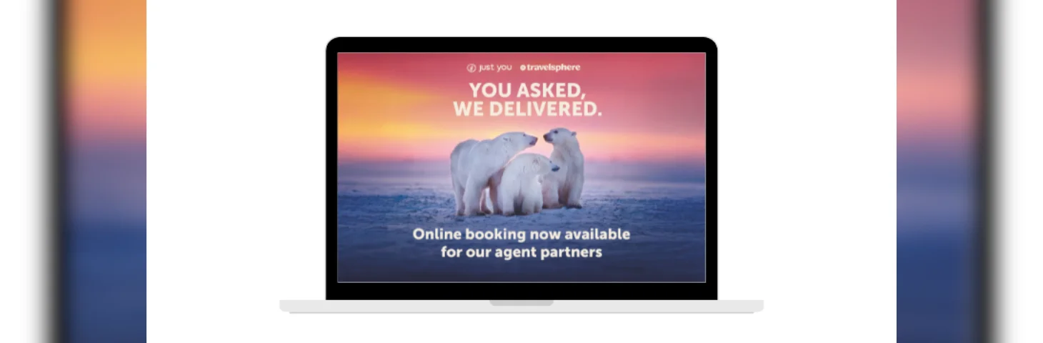 A laptop displaying a promotional banner regarding Just You and Travelsphere's integration into the Sherpa booking platform.