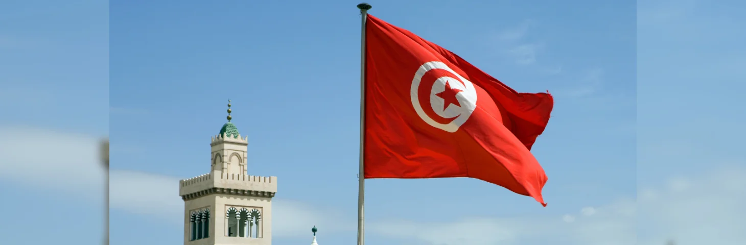 The Tunisian flag waving outside Tunis Town Hall.