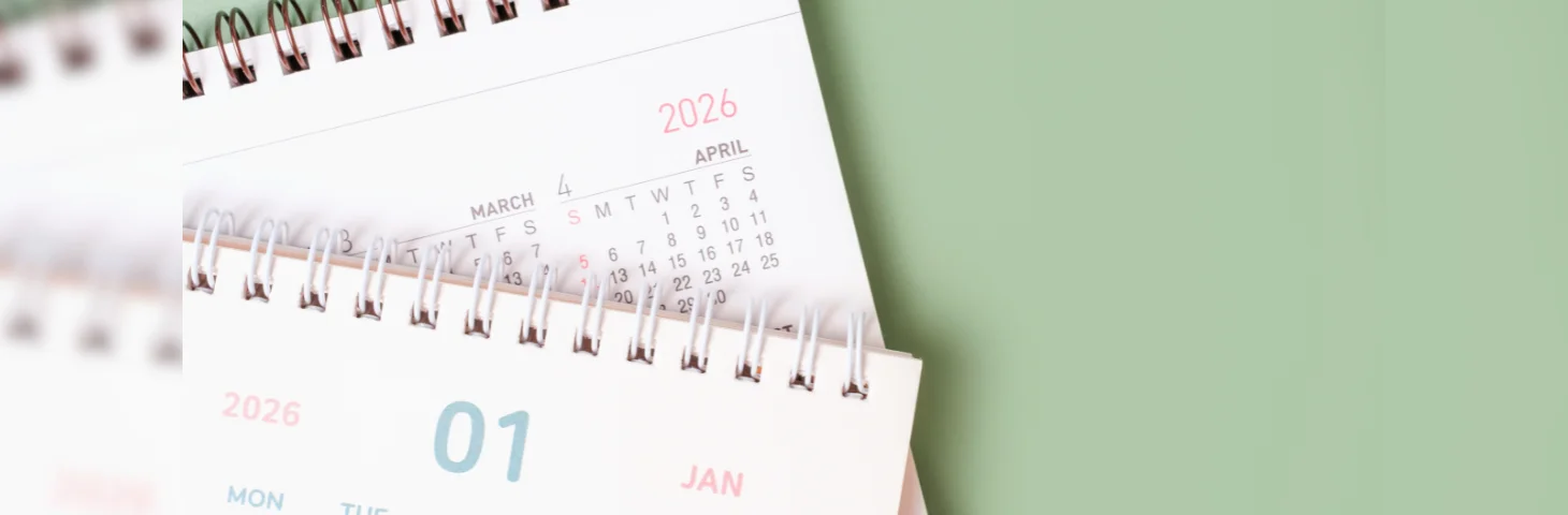 Two 2026 calendars open on the pages for January and all 12 months.