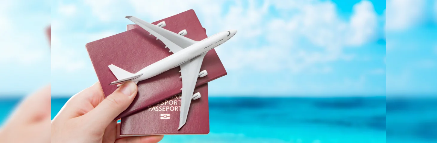 Two passports and a plane replica