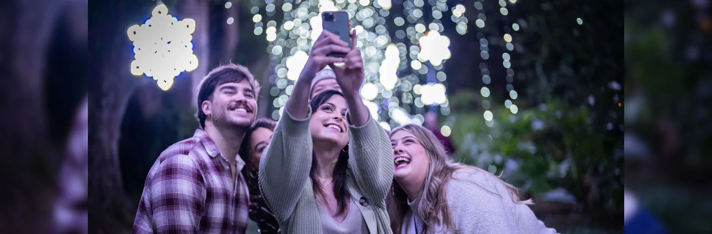 A group of friends taking a selfie at a tourist attraction in Orlando, Florida.