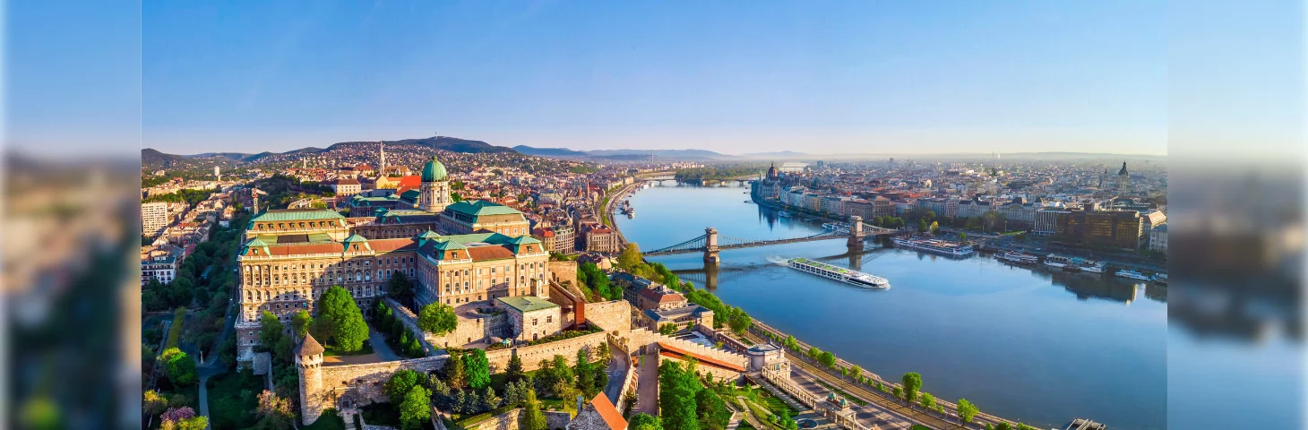 A panoramic view of the Buda Castle complex and the Danube River in Budapest, Hungary. 