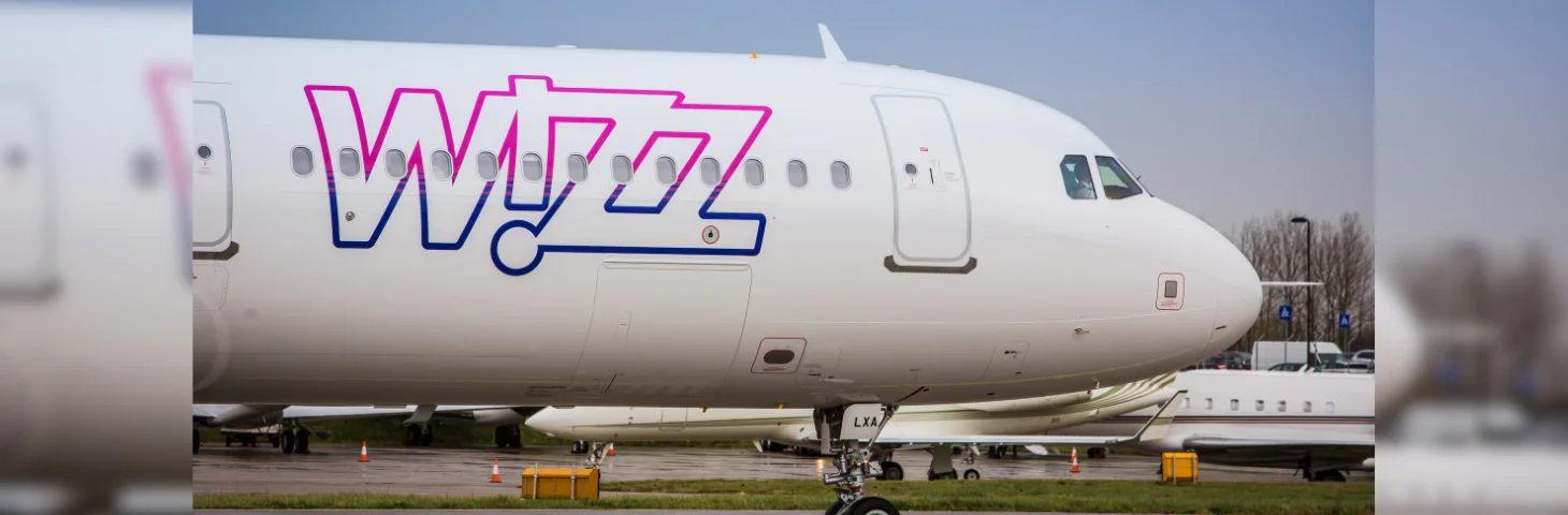 The Wizz Air livery on the nose of an Airbus A321 aircraft.
