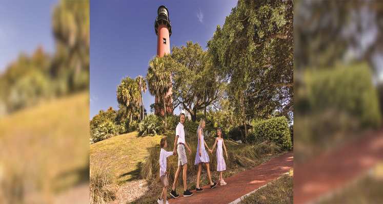 A family of four walking near Jupiter Lighthouse, The Palm Beaches
