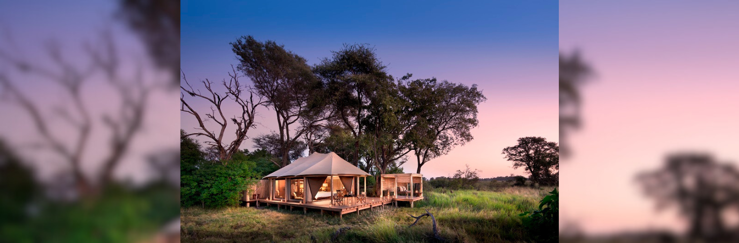 Botswana Nxabega Okavango Tented Camp Tent exterior at sunset