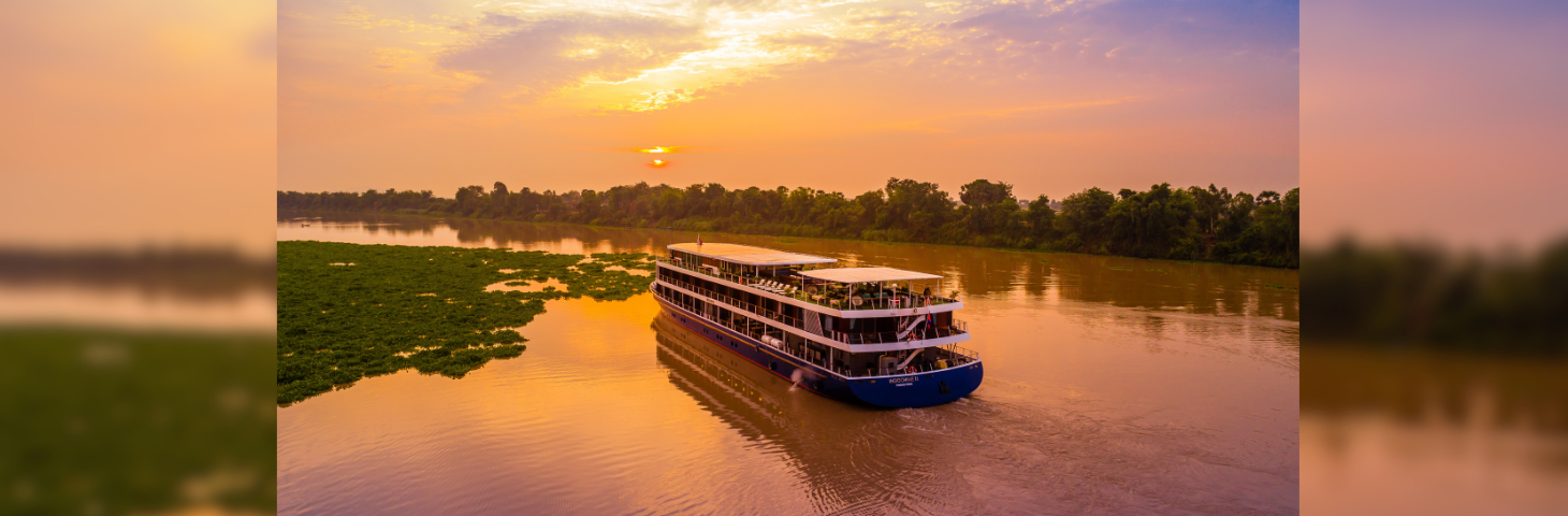 Image of a CroisiEurope vessel sailing along the Mekong. 