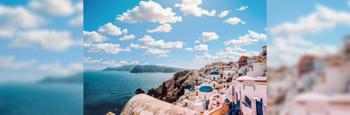 A hillside view of Mykonos and the Mediterranean Sea.