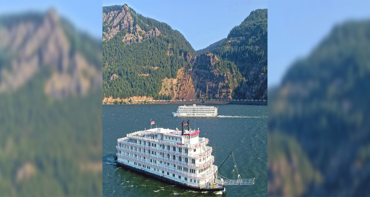 Two American Cruise Lines ships sailing on the Columbia & Snake rivers