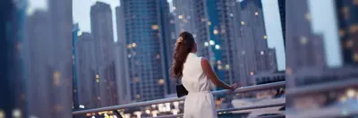 A lady overlooking the Dubai skyline.