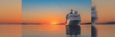 MS Caledonian at sea during sunset.
