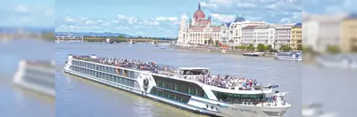 M.S. Oscar Wilde sailing on the Danube in Budapest, passing the Hungarian Parliament Building
