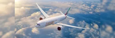 A newly retrofitted four-class Emirates Boeing 777-300ER in flight.