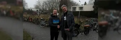 Intrepid CEO James Thornton and Sawadee Managing Director Berend Simons shaking hands after Intrepid Travel's acquisition of Sawadee.